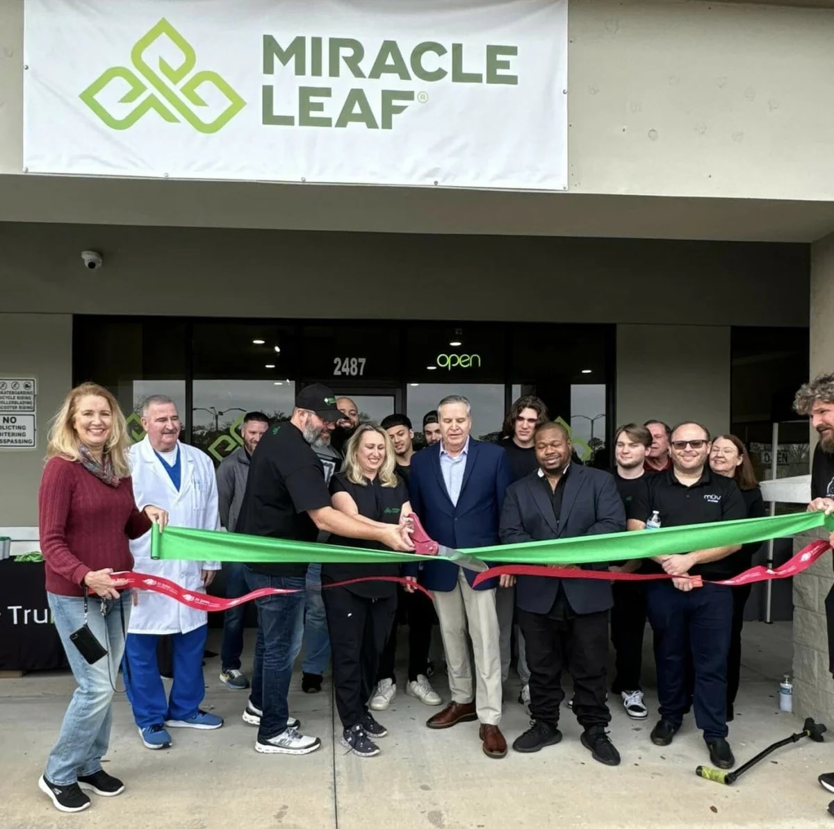 Miracle Leaf clinic storefront with grand opening ribbon